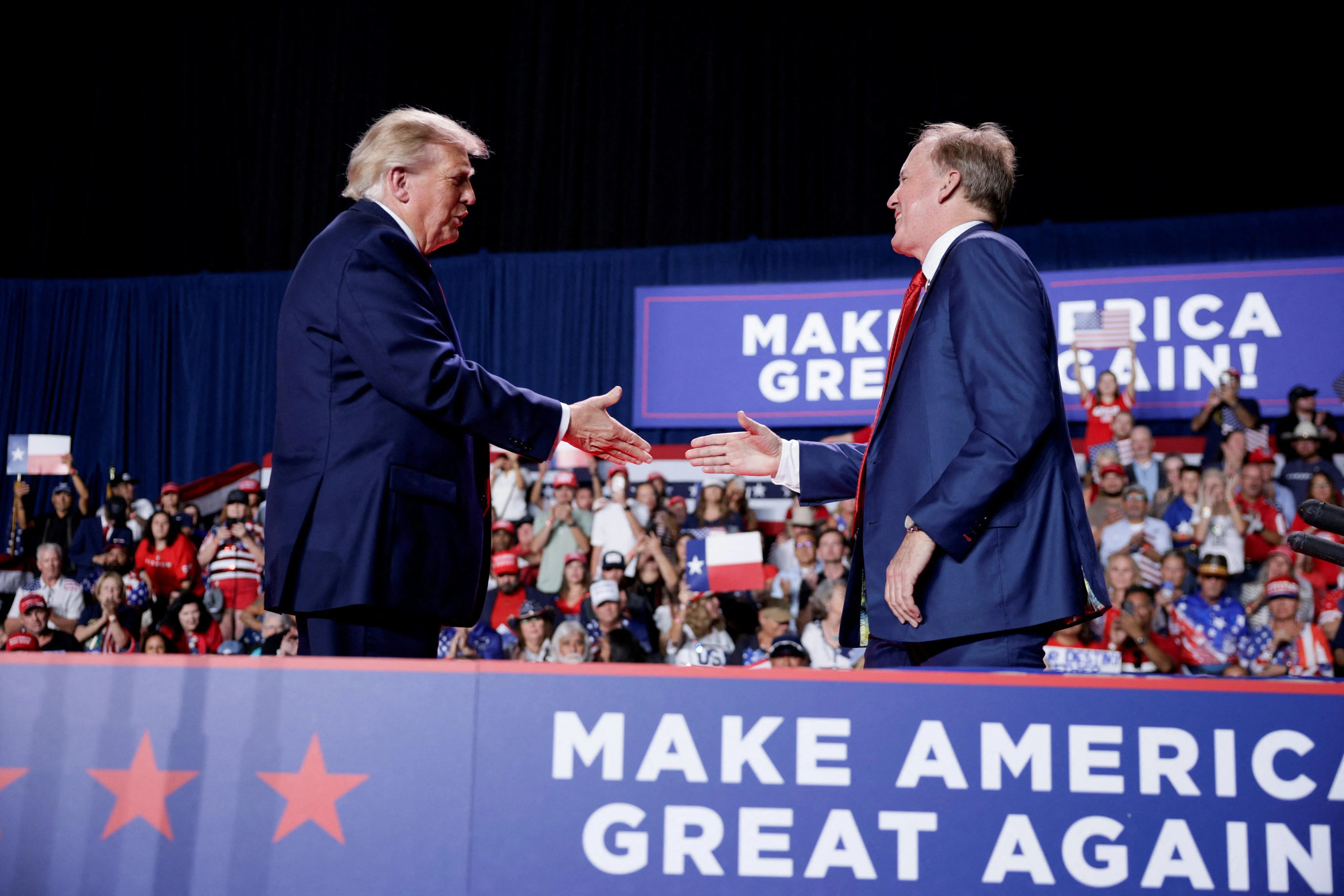 US President Donald Trump shaking hands with Republican US Senate candidate Ken Paxton at a campaign rally in San Antonio, Texas, on Oct 7.