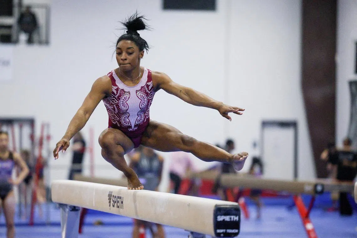 FILE PHOTO: Simone Biles runs through a portion of her beam routine during the second day of a two-day media event with the USA Gymnastics team ahead of the 2024 Olympics in Katy, Texas, U.S. February 5, 2024.  REUTERS/Kaylee Greenlee Beal/File Photo