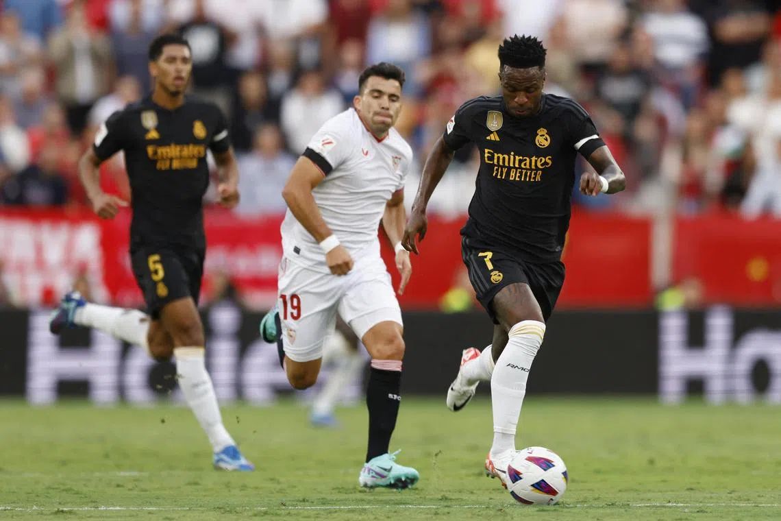 Real Madrid's Vinicius Junior (right) in action against Sevilla in the Spanish La Liga, a match in which he was again subject to racial abuse.