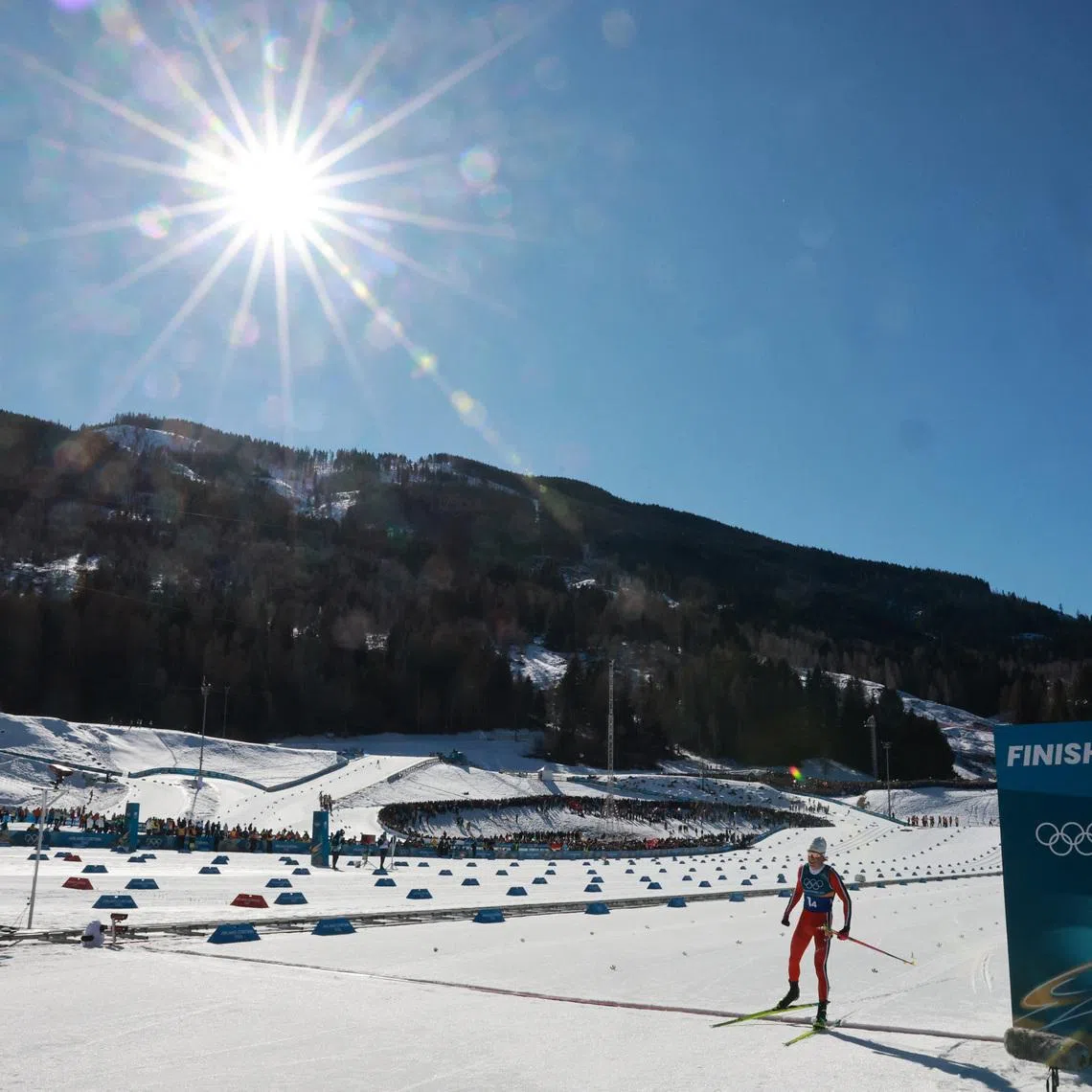 Milano Cortina 2026 Olympics - Cross-Country Skiing - Men's 4 x 7.5km Relay - Tesero Cross-Country Skiing Stadium, Lago, Italy - February 15, 2026. General view as Johannes Hoesflot Klaebo of Norway crosses the line to win gold for Norway in the Men's 4 x 7.5km Relay REUTERS/Stephanie Lecocq
