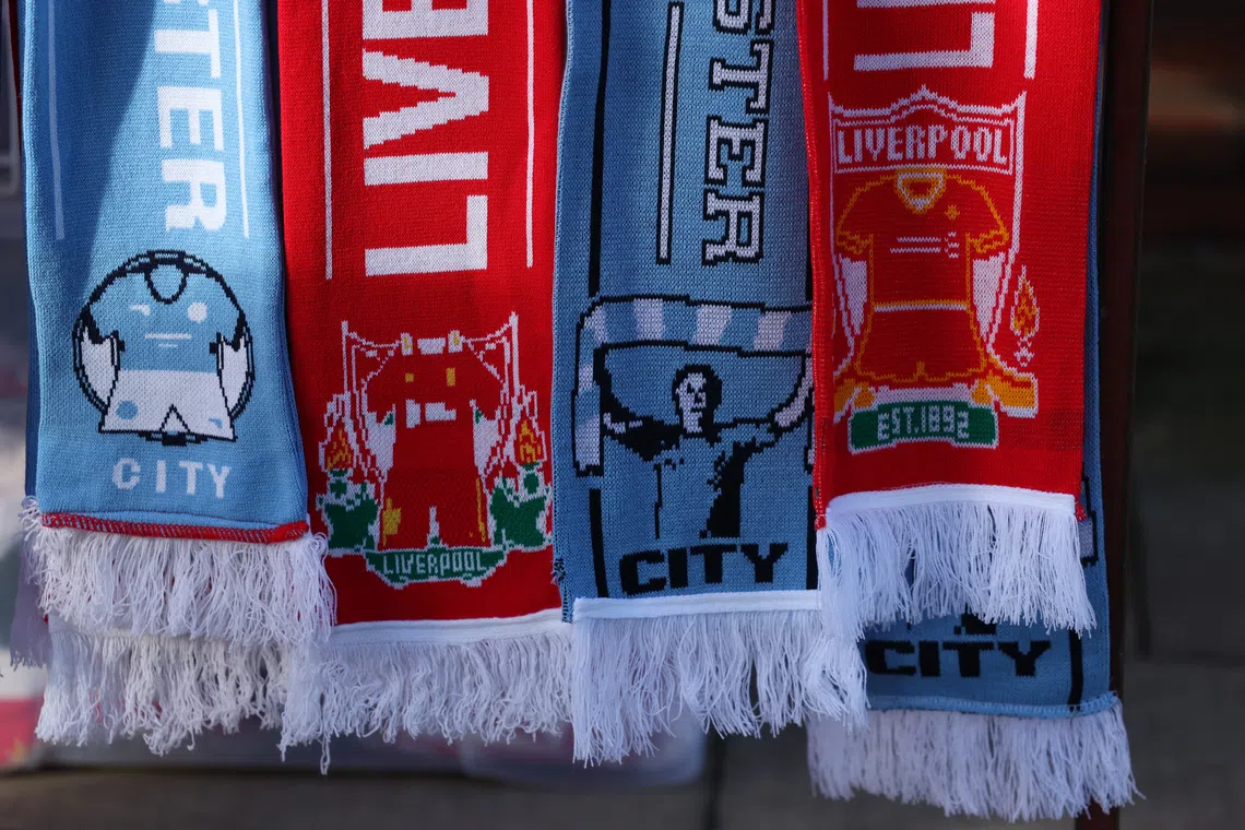FILE PHOTO: Soccer Football - Premier League - Liverpool v Manchester City - Anfield, Liverpool, Britain - December 1, 2024  Liverpool and Manchester City scarfs are seen outside the stadium before the match REUTERS/Phil Noble/File Photo