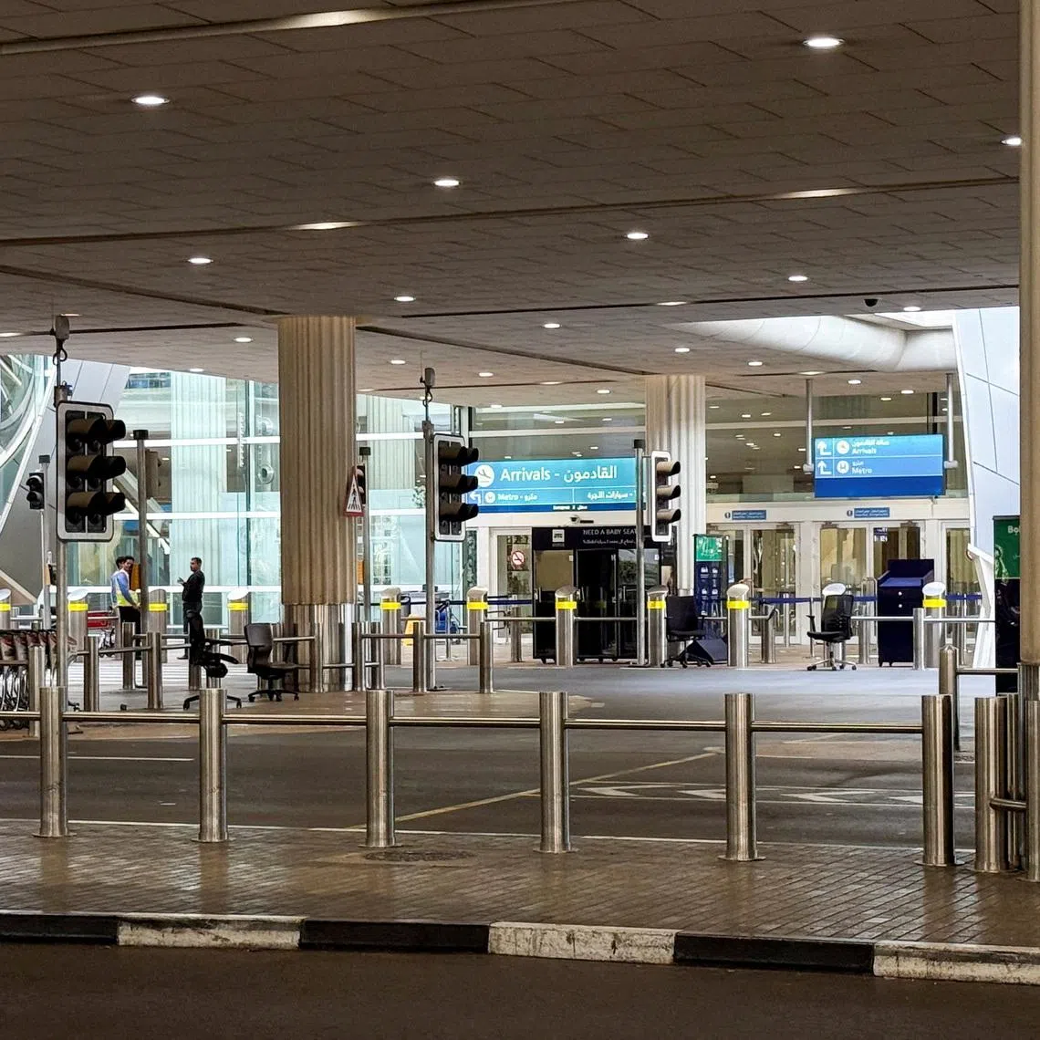 An empty arrivals area at the Dubai International Airport, following the United States and Israel strikes on Iran, in Dubai, United Arab Emirates, March 2, 2026. Picture taken using a mobile phone. REUTERS/Raghed Waked