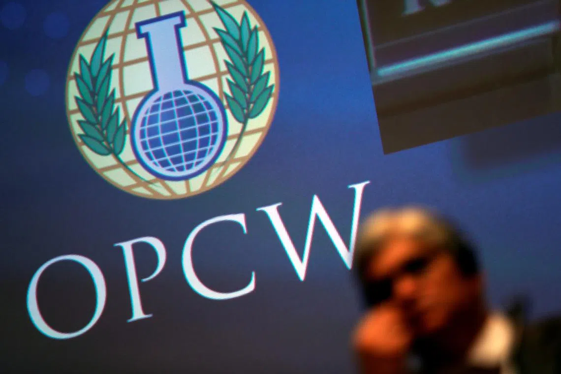 FILE PHOTO: The logo of the Organisation for the Prohibition of Chemical Weapons (OPCW) is seen during a special session in the Hague, Netherlands June 26, 2018. REUTERS/Yves Herman/File Photo