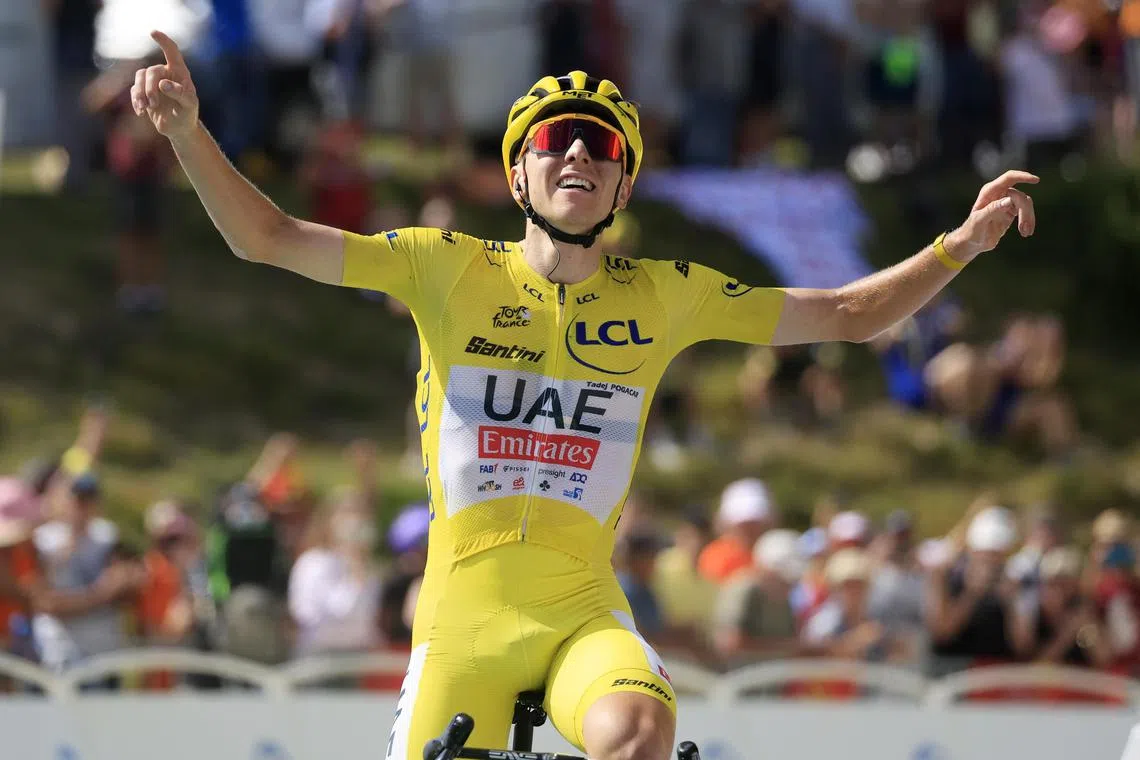 Yellow jersey holder Tadej Pogacar of UAE Team Emirates celebrating as he crosses the finishing line to win the 15th stage of the 2024 Tour de France cycling race over 197km from Loudenvielle to Plateau de Beille on July 14.