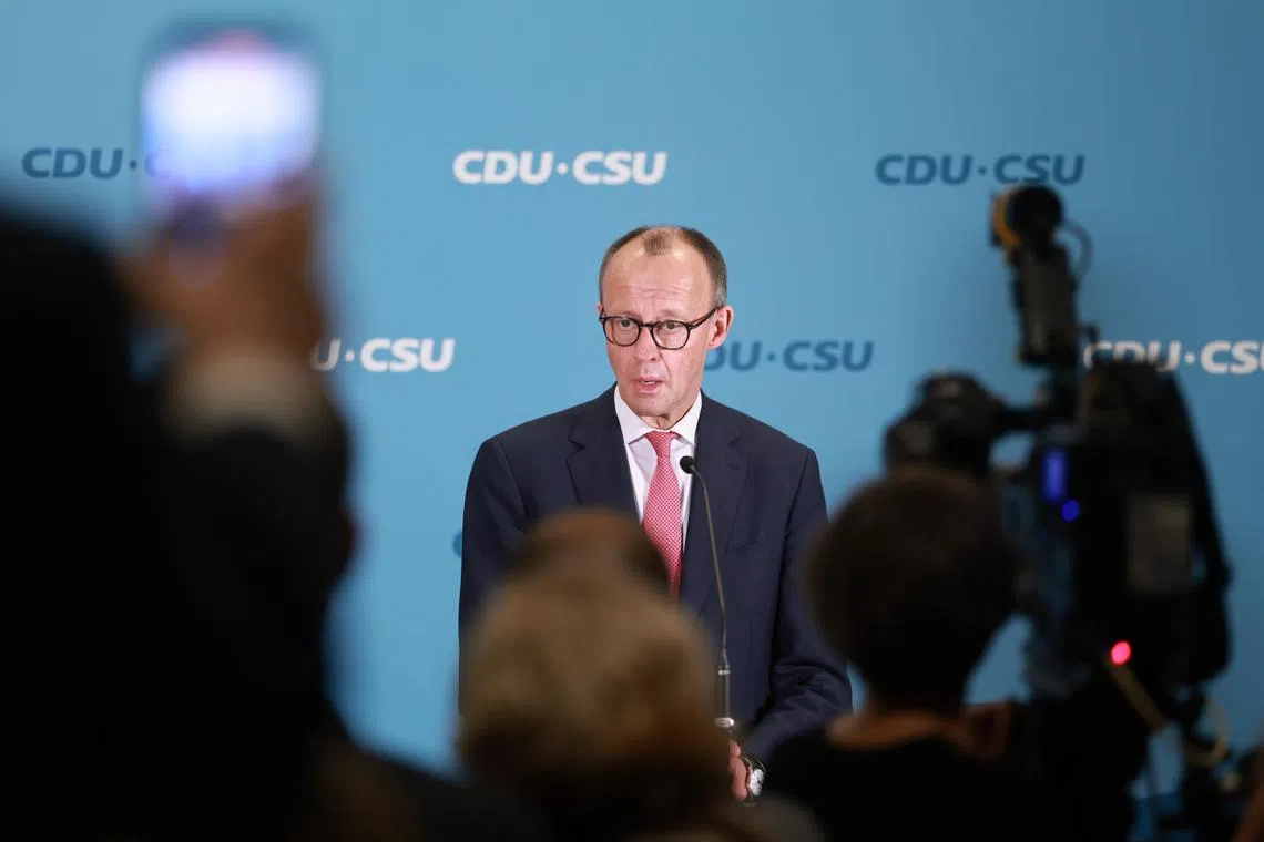Christian Democratic Union chairman Friedrich Merz speaking to the media after the vote, on Jan 31. 
