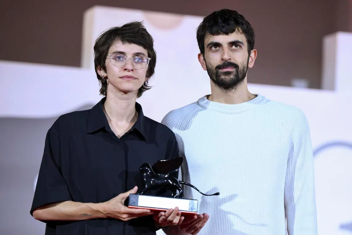 Israeli directors Rachel Szor (left) and Yuval Abraham holding the Special Jury Prize for their film NAZA at Venice International Film Festival on Sept 12.
