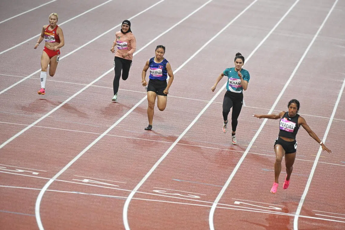 Singapore sprinter Shanti Pereira (right) clocked 11.42 seconds, finishing third in Heat 2.