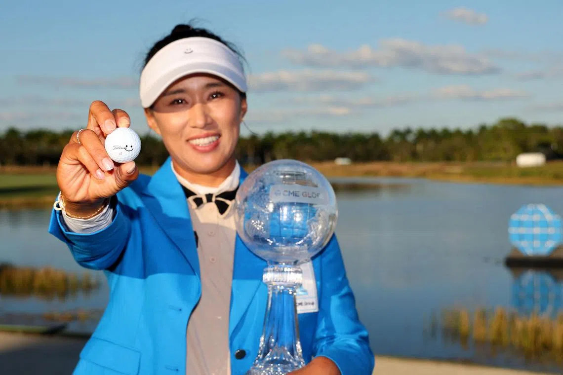 South Korea's Amy Yang posing with the CME Globe trophy after winning the LPGA Tour Championship at Tiburon Golf Club in Florida.