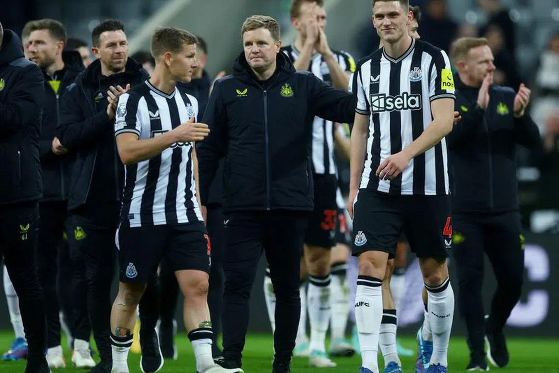 Soccer Football - Premier League - Newcastle United v Fulham - St James Park, Newcastle, Britain - December 16, 2023 Newcastle United manager Eddie Howe and Sven Botman celebrate after the match Action Images via Reuters/Lee Smith/File Photo