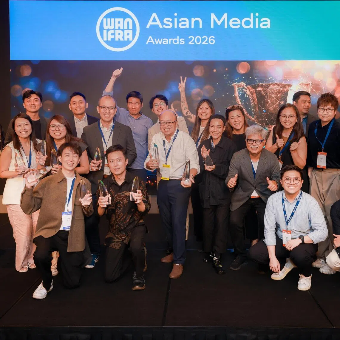 SPH Media managing director Kuek Yu Chuang (back row, fourth from left) with SPH Media winners and attendees at the WAN-IFRA Asian Media Awards on Oct 26.