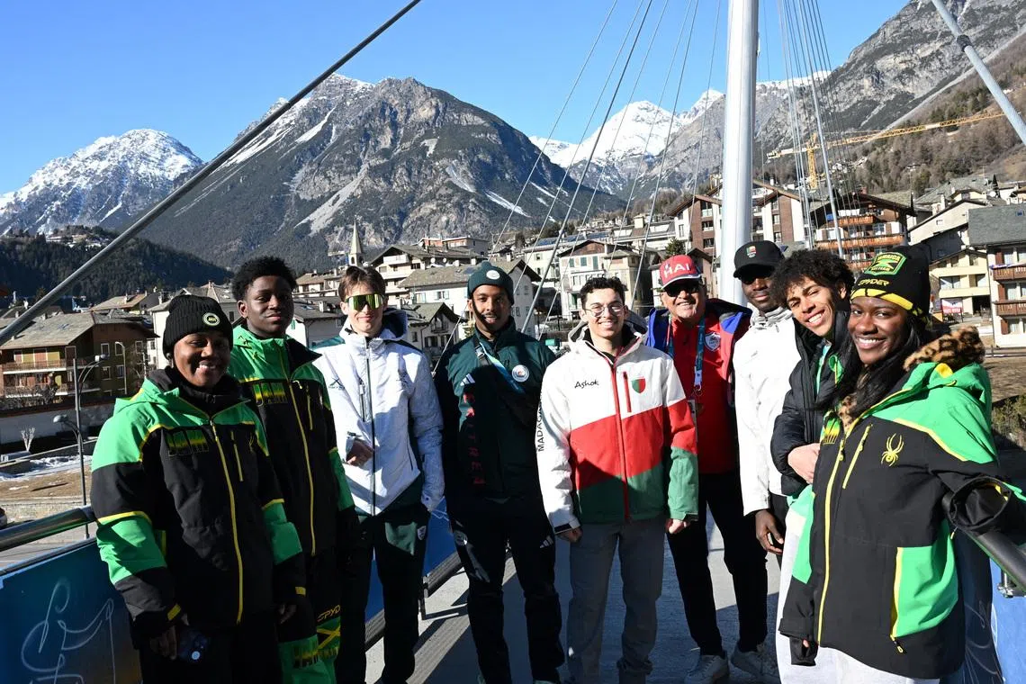 Milano Cortina 2026 Winter Olympics - Stadium, City, Italy - Month Day, 2026 A group of skiers from Jamaica, South Africa, Eritrea, Madagascar, Benin and Kenya stand together ahead of the alpine skiing slalom race at the Milano Cortina 2026 Winter Olympics, in Bormio,Italy - February 15, 2026 REUTERS/ Angelika Warmuth