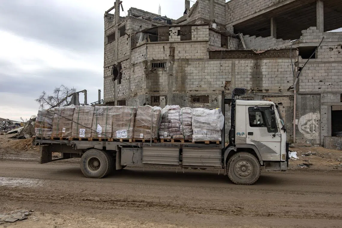 epa11921661 A truck carrying humanitarian aid drives past damaged buildings along Salah al-Din road, amid a ceasefire between Israel and Hamas, in Rafah, southern Gaza Strip, 24 February 2025. According to the United Nations Relief and Works Agency for Palestine Refugees (UNRWA), thousands of trucks carrying essential humanitarian aid have crossed into the Gaza Strip since the first phase of a six-week ceasefire deal between Israel and Hamas came into effect on 19 January 2025. EPA-EFE/HAITHAM IMAD