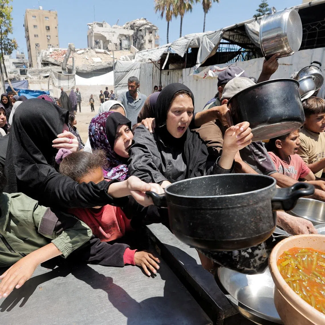Palestinians gather to receive food from a charity kitchen, in Gaza City, June 2, 2026. REUTERS/Dawoud Abu Alkas