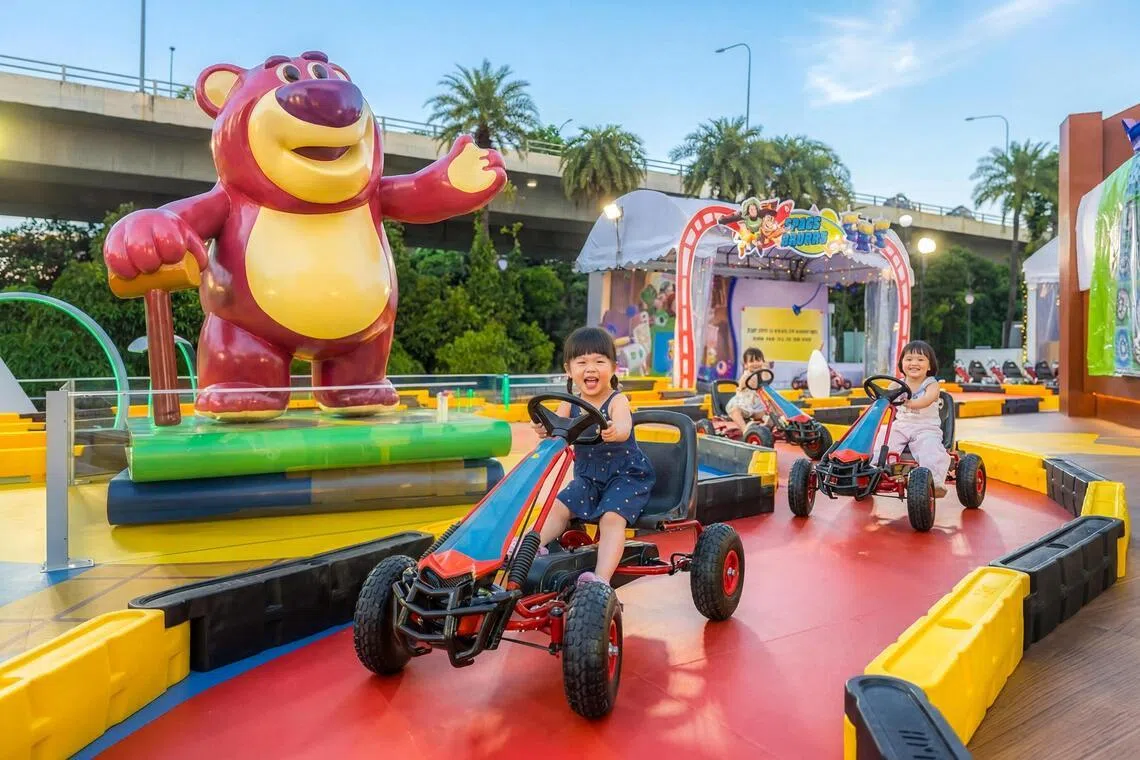Kids can pedal in a circuit surrounded by Toy Story characters including Lots-o'-Huggin' Bear.