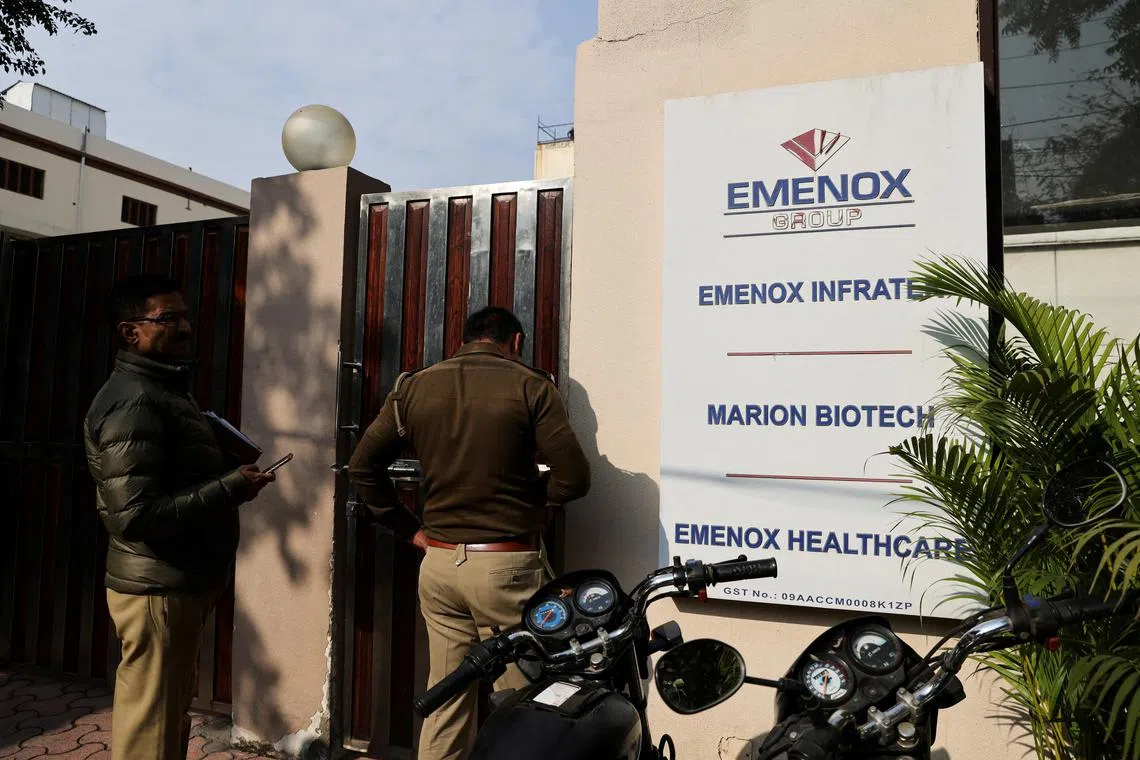 In this Dec 29, 2022 photo, Indian police are seen at the gate of an office of Marion Biotech, a healthcare and pharmaceutical company and a part of the Emenox Group, whose cough syrup has been linked to the deaths of children in Uzbekistan.