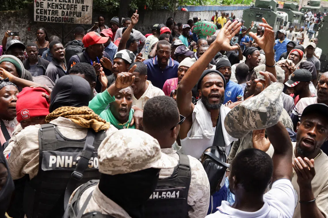 Residents protest against insecurity after a fatal overnight raid by an armed gang, on the outskirts of Port-au-Prince, in Kenscoff, Haiti, August 24, 2026. REUTERS/Fildor Pq Egeder
