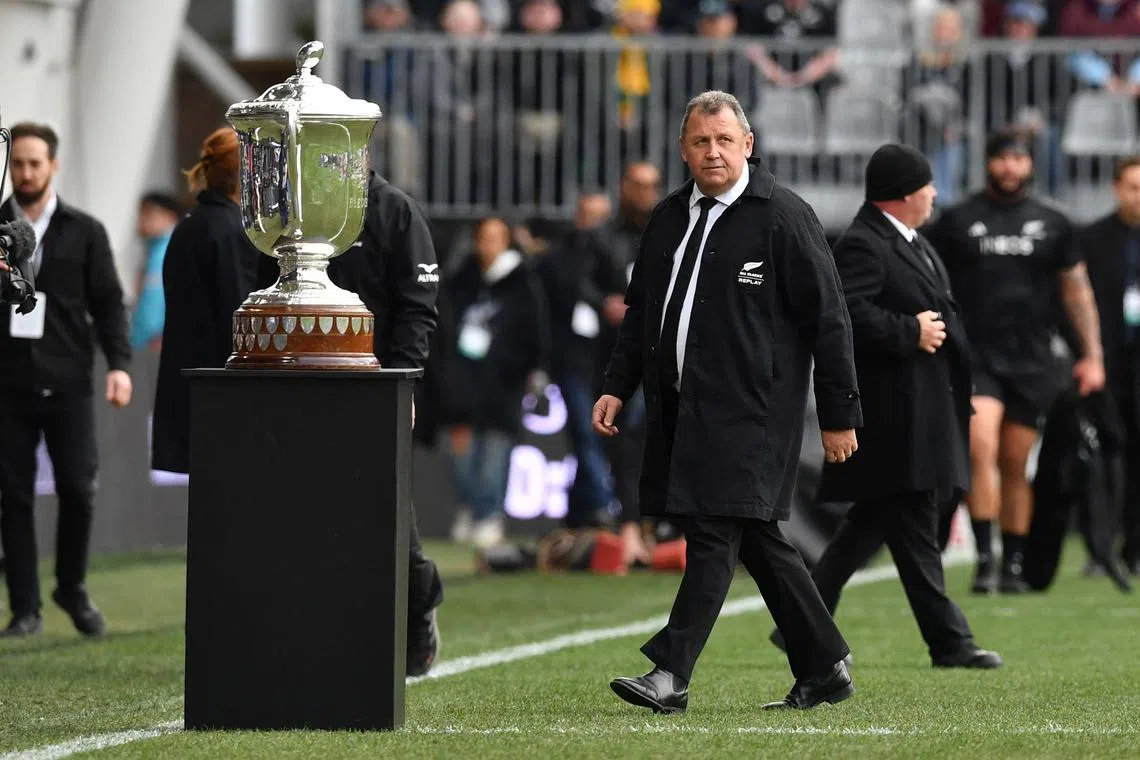 New Zealand's head coach Ian Foster walks past the trophy prior to match between Australia and New Zealand.