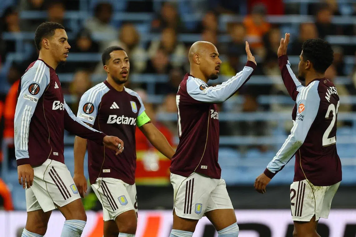Aston Villa's Donyell Malen celebrates scoring their second goal with Ian Maatsen.
