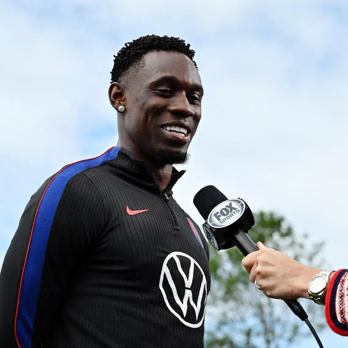 United States striker Folarin Balogun speaking to the media before training on July 3.