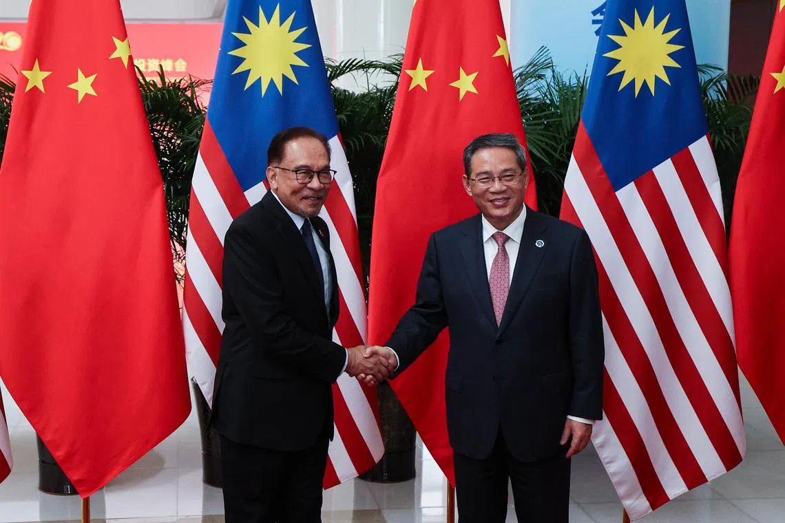 Malaysia Prime Minister Anwar Ibrahim (left) and his Chinese counterpart Li Qiang meet at the Liyuan Guest House in Nanning, China, on Sept 17, 2023. 