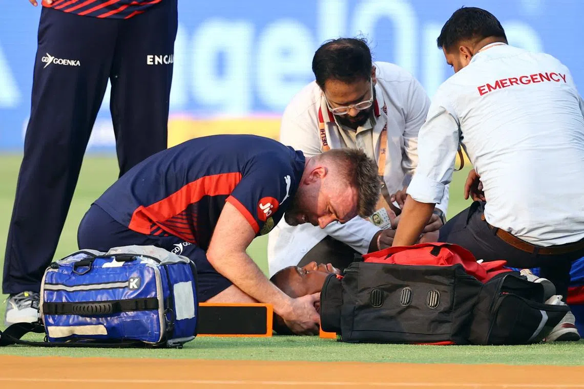 Cricket - Indian Premier League - IPL - Delhi Capitals v Punjab Kings - Arun Jaitley Stadium, New Delhi, India - April 25, 2026 Delhi Capitals' Lungi Ngidi receives medical attention after sustaining an injury REUTERS/Anushree Fadnavis