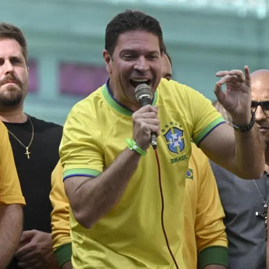 Brazil's former spy chief Alexandre Ramagem (centre) was sentenced to over 16 years in prison for plotting a coup with ex-president Jair Bolsonaro.