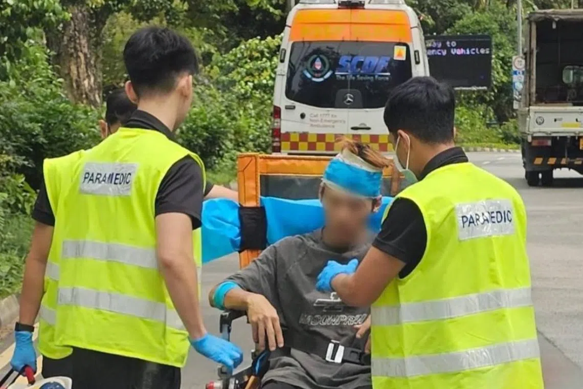 In pictures posted on social media, the 27-year-old man was seen being tended to by three SCDF paramedics.