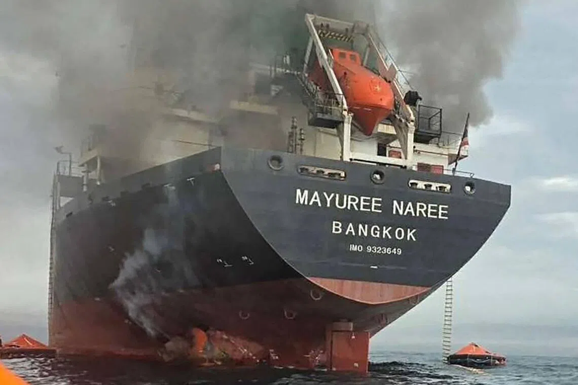 Thai bulk carrier Mayuree Naree engulfed in smoke near the Strait of Hormuz on March 11 after an attack, as seen in a photo released by the Royal Thai Navy.