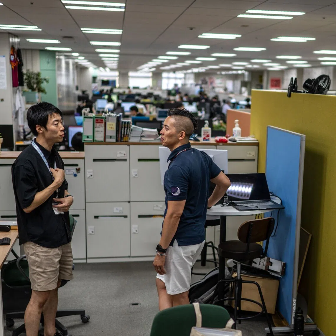 Government officials in casual dress code, including shorts, tee shirts and sneakers, as part of Tokyo’s ‘Cool Biz’ initiative.