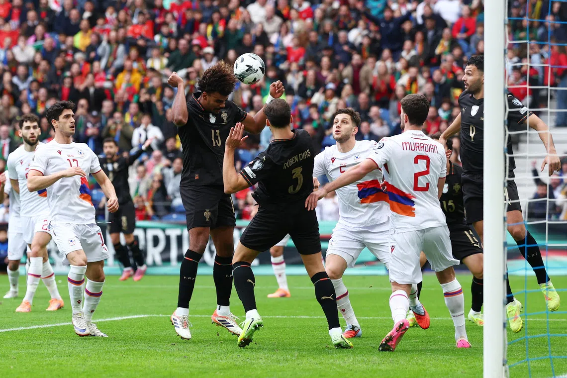 Soccer Football - World Cup - UEFA Qualifiers - Group F - Portugal v Armenia - Estadio do Dragao, Porto, Portugal - November 16, 2025 Portugal's Renato Veiga scores their first goal REUTERS/Pedro Nunes