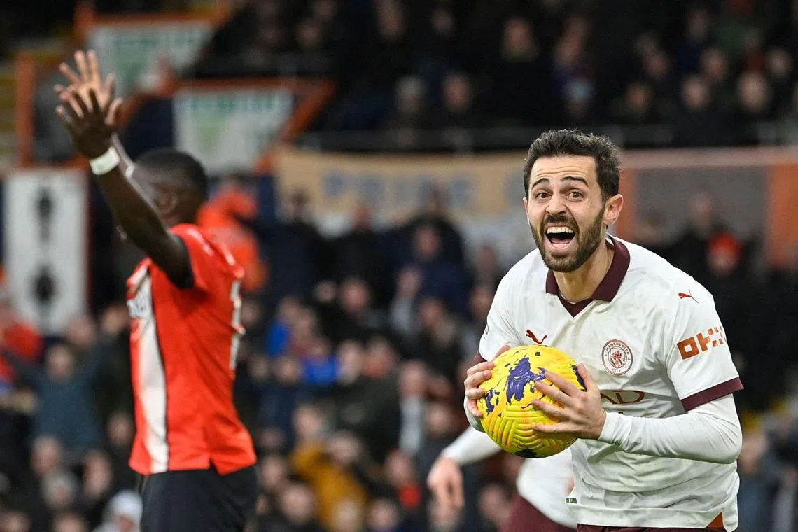 Manchester City's Portuguese midfielder Bernardo Silva celebrating his team's winner, scored by English midfielder Jack Grealish, during their 2-1 English Premier League triumph over Luton Town at Kenilworth Road on Dec 10. 