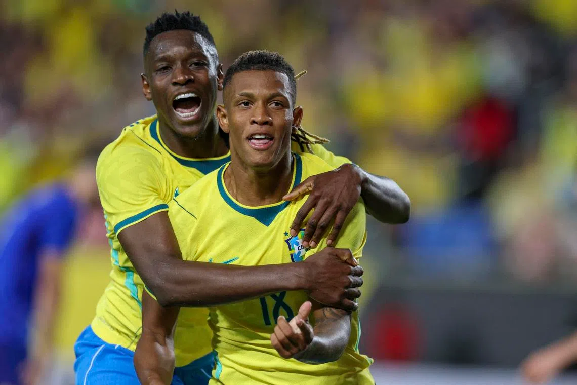 Mar 31, 2026; Orlando, Florida, USA; Brazil midfielder Danilo (18) reacts with forward Luiz Henrique (20) after scoring a goal against Croatia in the first half during an international friendly at Camping World Stadium. Mandatory Credit: Nathan Ray Seebeck-Imagn Images