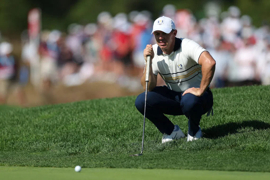 FILE PHOTO: Golf - The 2025 Ryder Cup - Bethpage Black Golf Course, Farmingdale, New York, United States - September 28, 2025 Team Europe's Rory McIlroy lines up his putt on the 11th hole during the singles REUTERS/Paul Childs/File Photo