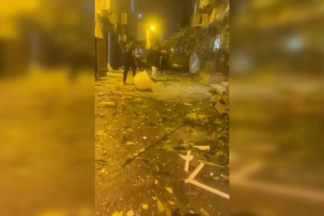 A video screengrab showing debris on the street after reported Iranian drone strikes in Sitra, Bahrain, on March 9.