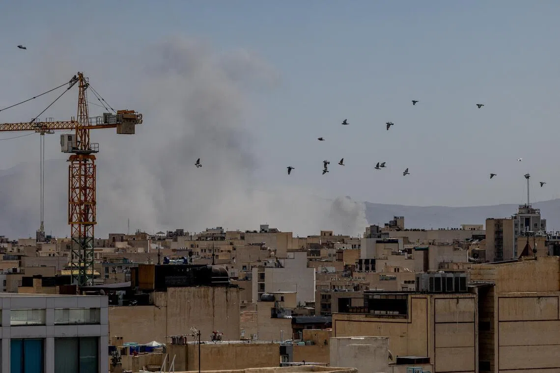 Smoke rising in Iran's capital, Tehran, after large explosions shook the city on Feb 28.