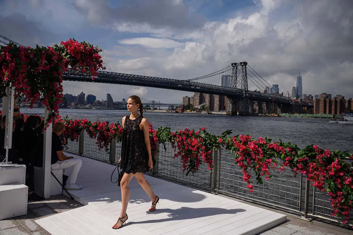 A model presents designs by US fashion designer Michael Kors during his New York Fashion Week runway show in the Brooklyn borough of New York City on Sept 11.