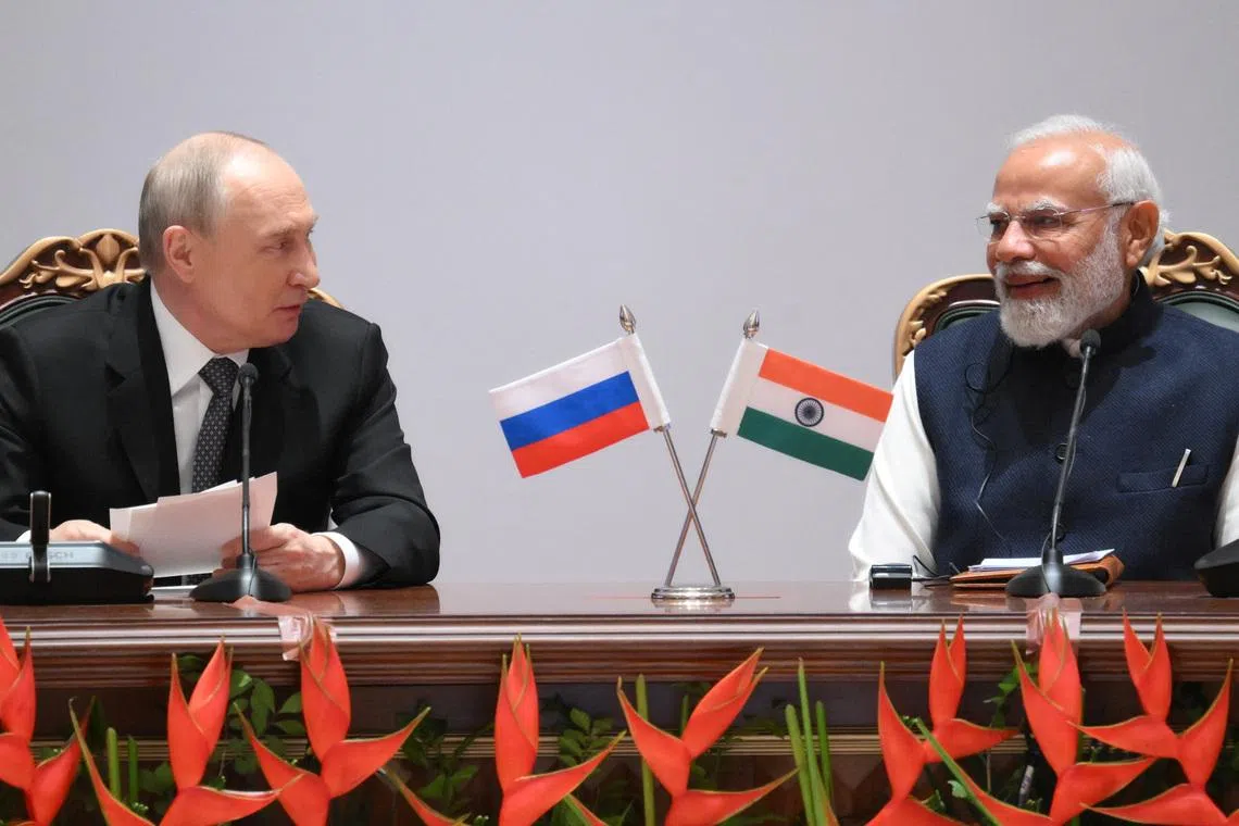Russia's President Vladimir Putin and India's Prime Minister Narendra Modi attend the India-Russia Business Forum in New Delhi, India, December 5, 2025. Sputnik/Grigory Sysoyev/Pool via REUTERS ATTENTION EDITORS - THIS IMAGE WAS PROVIDED BY A THIRD PARTY.