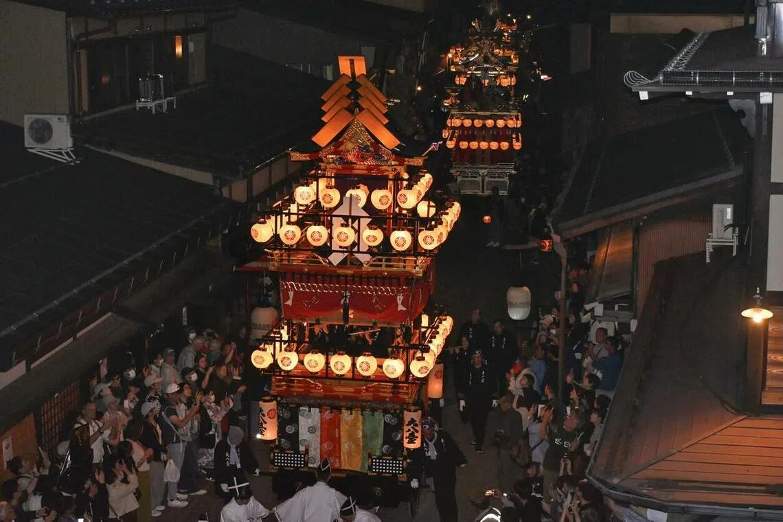 Colourful floats, lit by chochin lanterns on the first day of the two-day Takayama autumn festival on Oct 9.