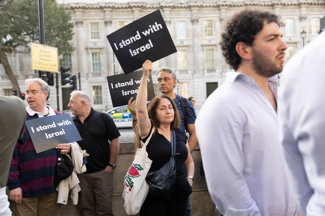 Pro-Israel demonstrators protest during the ongoing conflict between Israel and the Palestinian Islamist group Hamas in London.
