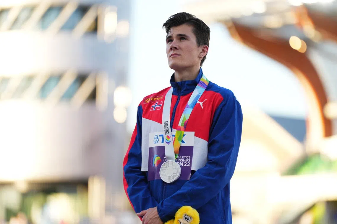 FILE PHOTO: Athletics - World Athletics Championships - Men's 1500 Metres - Final - Hayward Field, Eugene, Oregon, U.S. - July 19, 2022 Silver Medallist Norway's Jakob Ingebrigtsen reacts on the podium during the medal ceremony REUTERS/Aleksandra Szmigiel/File Photo