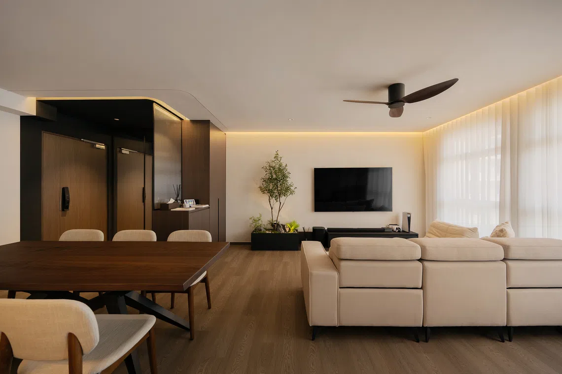 The young couple who own this Tampines flat wanted a modern Japandi interior in American walnut with space to entertain and a flexible layout.
