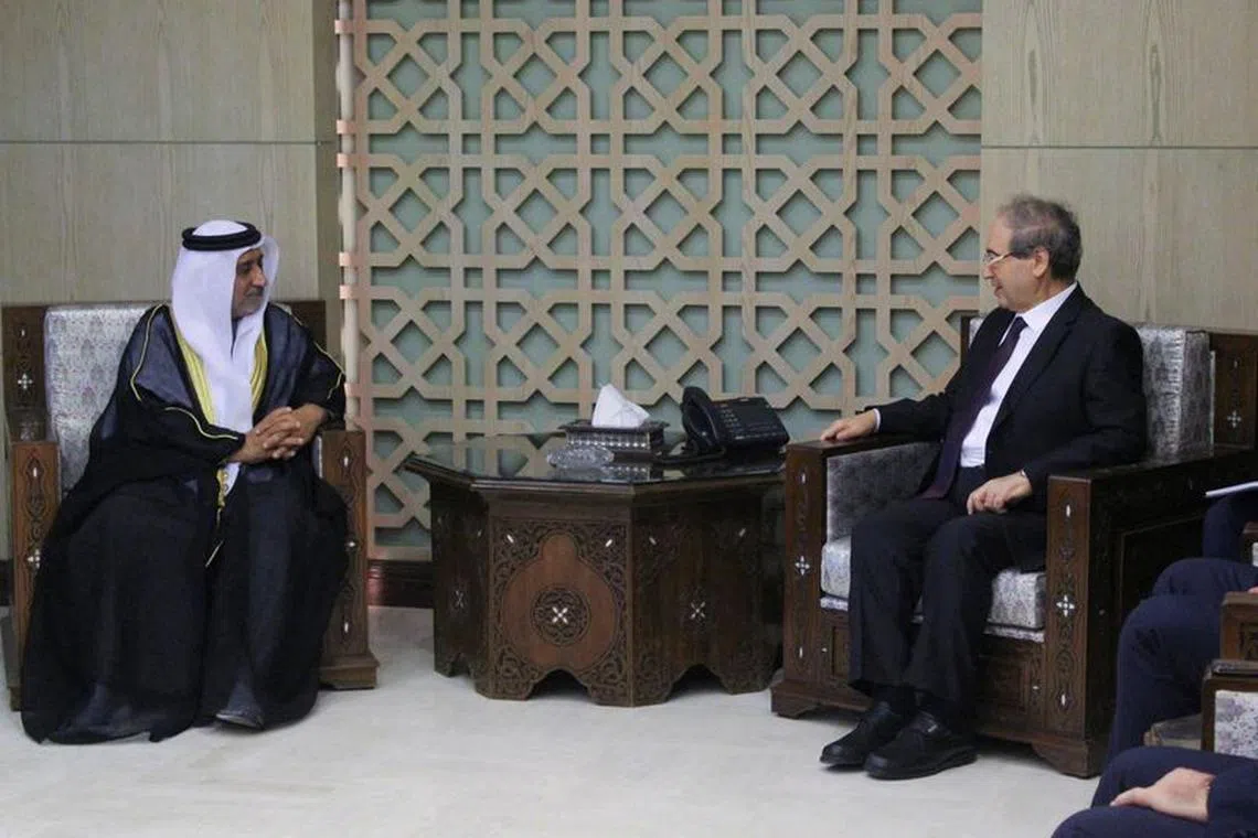 Syrian Foreign Minister Faisal Mekdad meets with new ambassador of the United Arab Emirates to Syria, Hassan al-Shehi, in Damascus, Syria January 30, 2024. REUTERS/Firas Makdesi