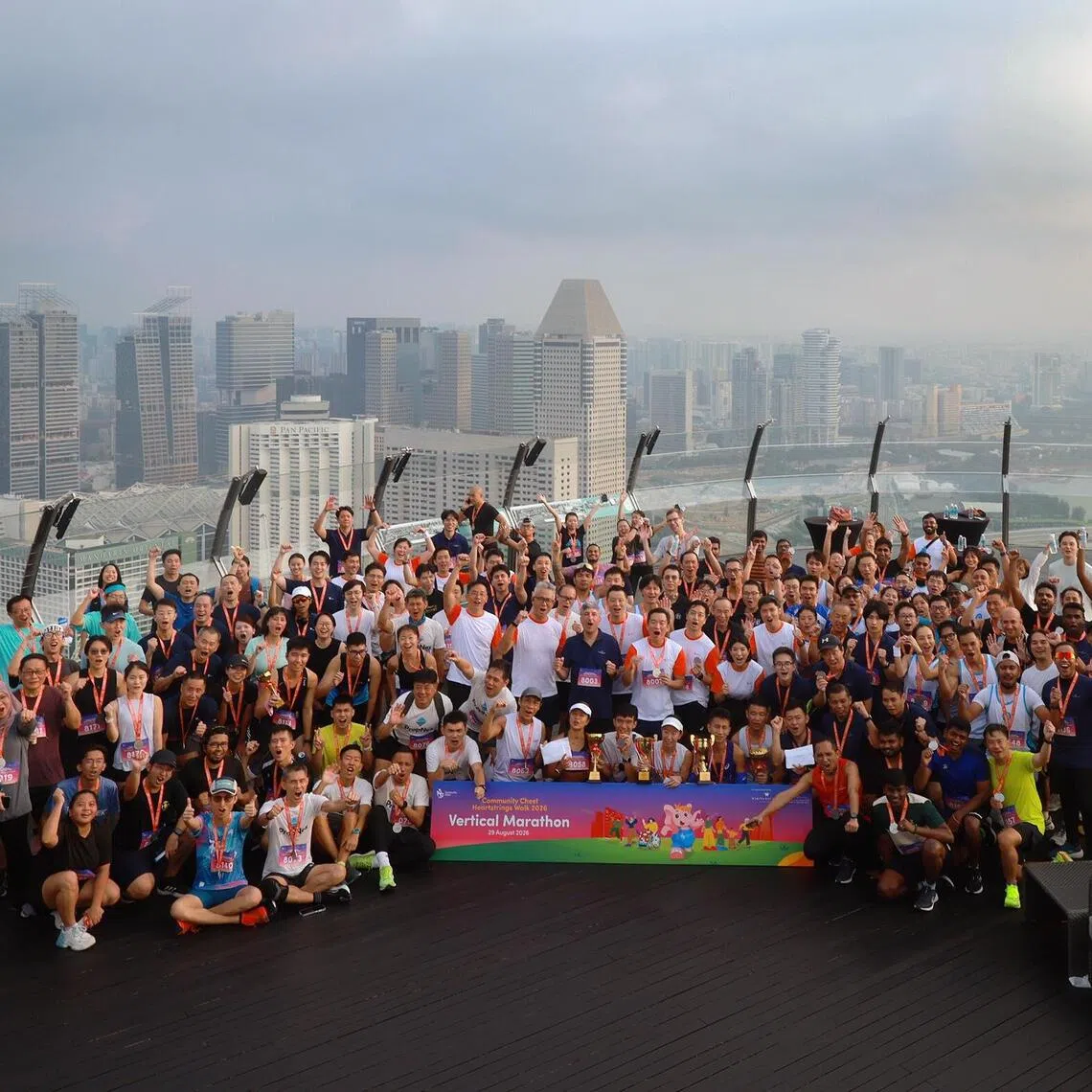 Participants posing for a photo at the Marina Bay Sands SkyPark, after competing in a vertical marathon by Community Chest in collaboration with the Marina Bay Sands, on Aug 29.
