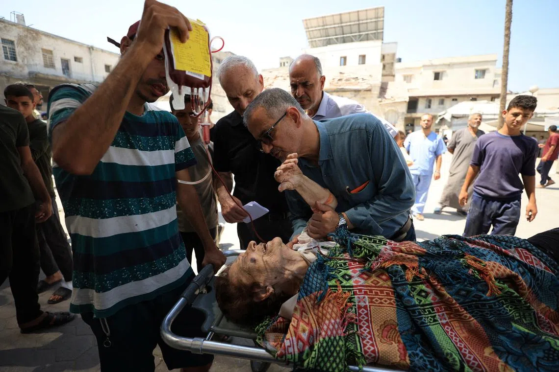 A wounded Palestinian Christian woman is brought into at Al-Ahli Arab Hospital following an Israeli strike on The Church of the Holy Family, according to medics, in Gaza City July 17, 2025. REUTERS/Dawoud Abu Alkas