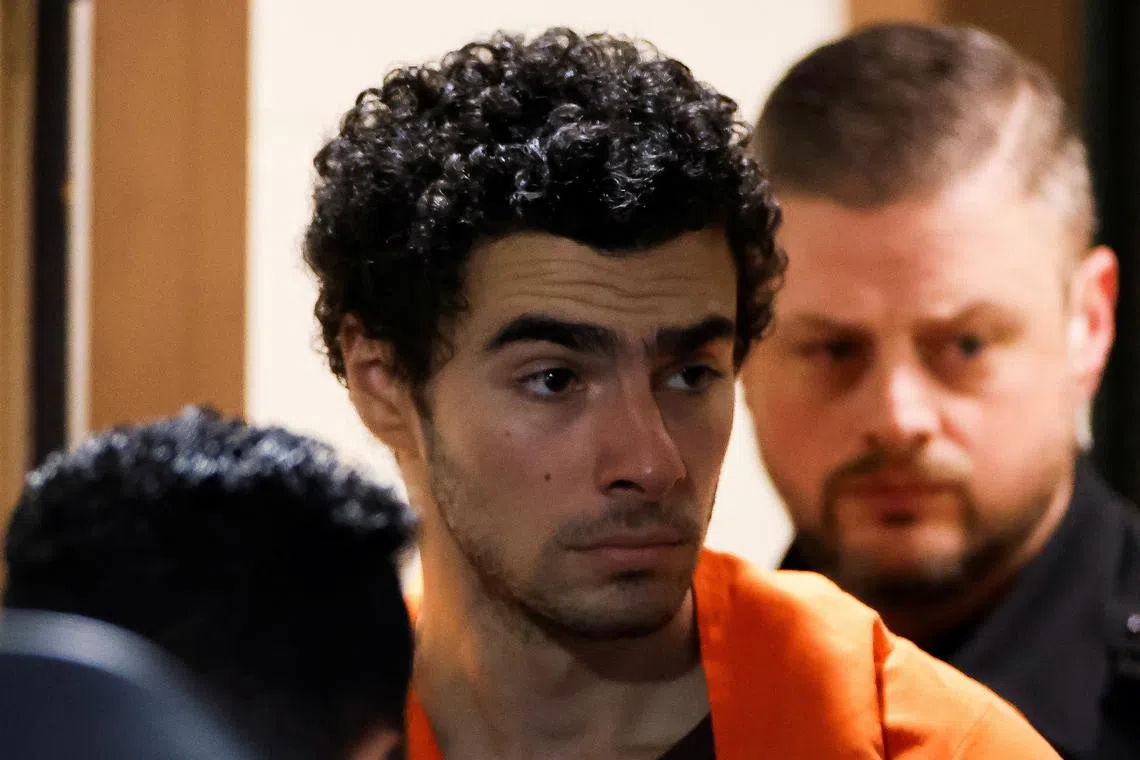 FILE PHOTO: Luigi Mangione, 26, a suspect in the New York City killing of UnitedHealth executive Brian Thompson, is escorted after an extradition hearing at Blair County Court House in Hollidaysburg, Pennsylvania, U.S. December 10, 2024. REUTERS/Eduardo Munoz/File Photo
