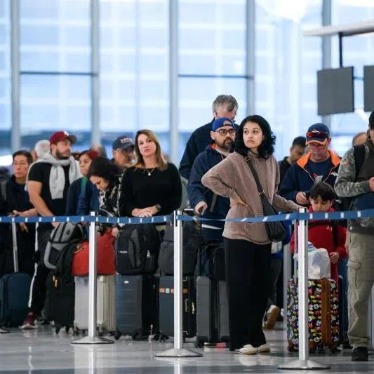 People wait in a security checkpoint line at George Bush Intercontinental Airport in Houston, Texas, on Nov 4.