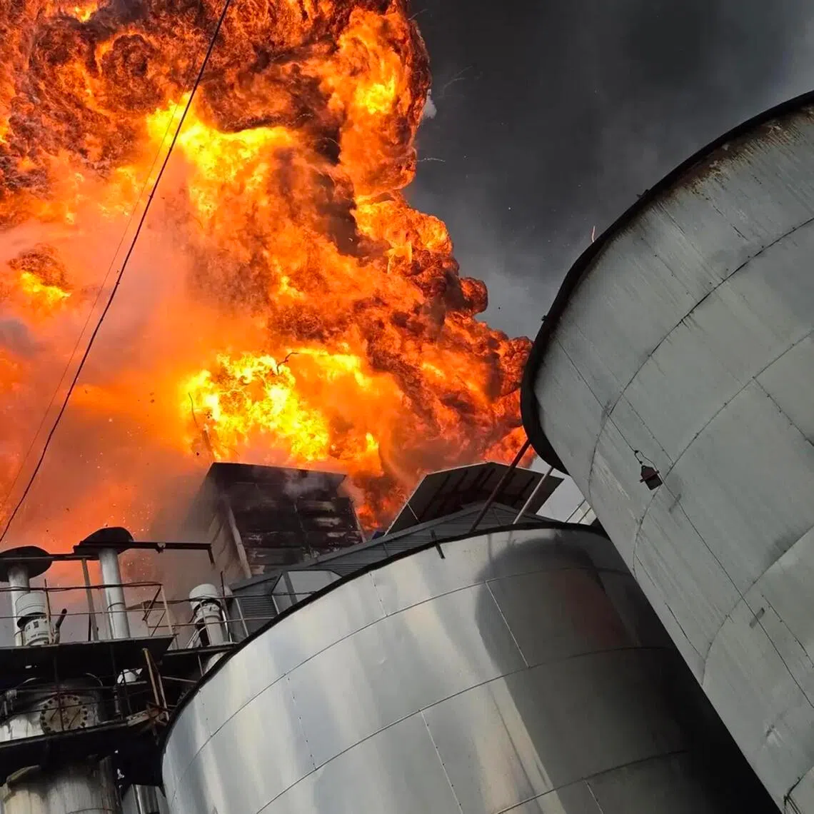 Flame and smoke fumes out from a factory producing raw materials for paint in South Korea’s South Chungcheong province, on Aug. 28.
