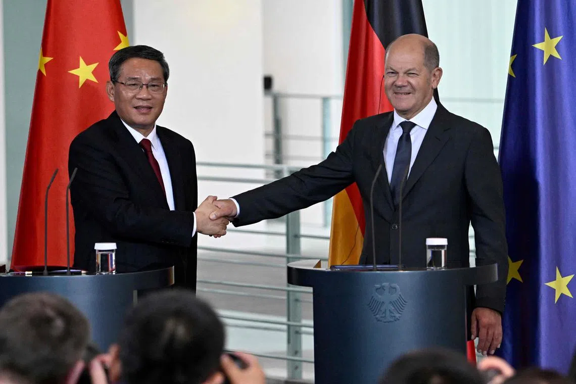 China's Prime Minister Li Qiang (left) and German Chancellor Olaf Scholz during a joint news conference in Berlin on Tuesday.
