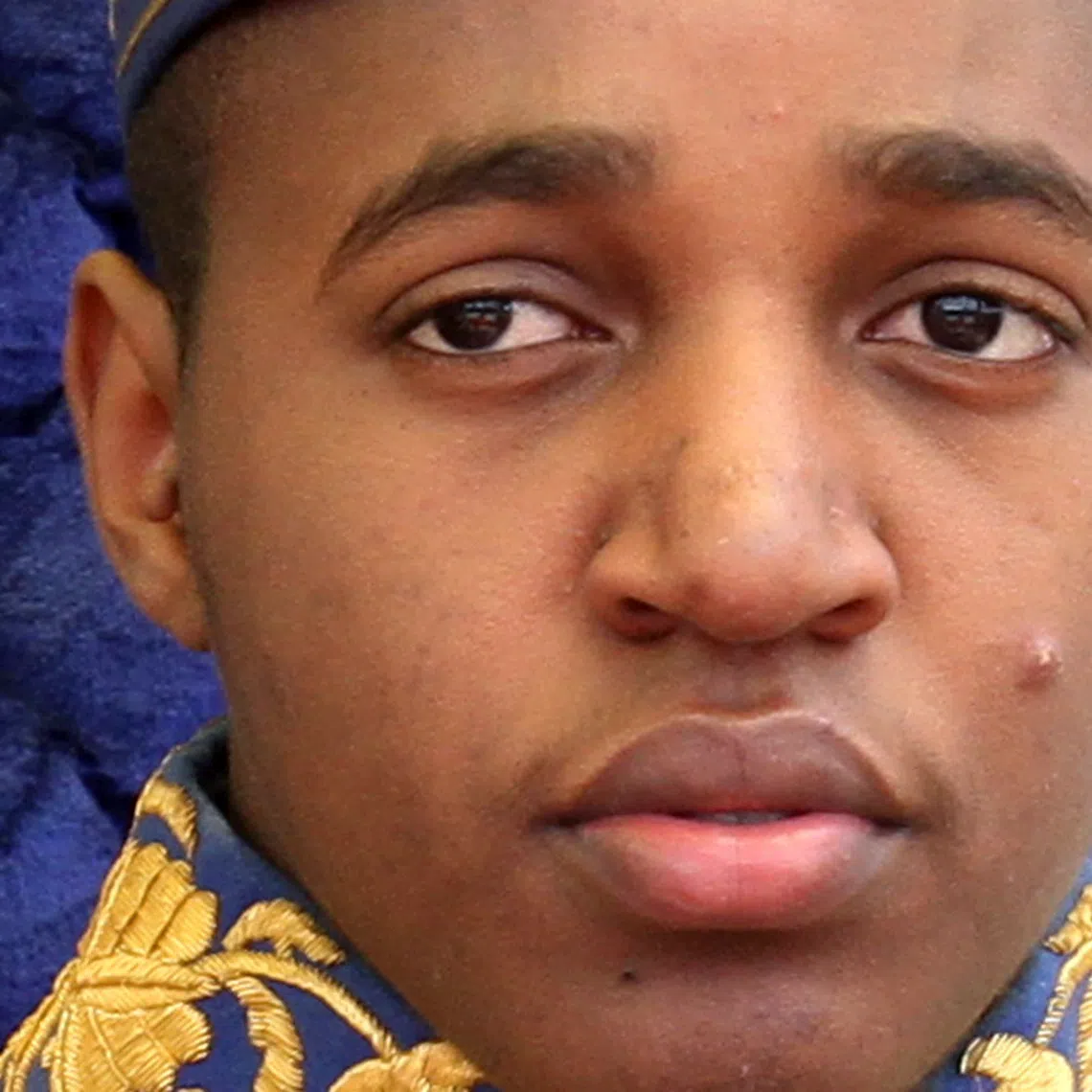 King Oyo Nyimba Kabamba Irugu Rukidi IV sits on the throne at his palace in Fort Portal, 270 km (168 miles) southwest of Kampala April 17, 2010. King Oyo, 18, the youngest king in the world, ascended the throne aged three, after his father, the late King Patrick Kaboyo died in 1995.  REUTERS/James Akena