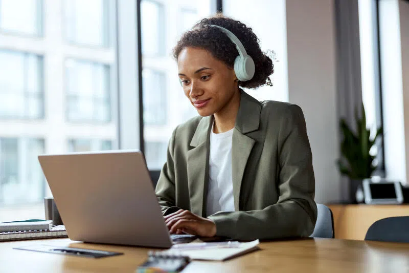 Headphones at work may boost productivity, but recent research shows they can leave a less positive impression on others.